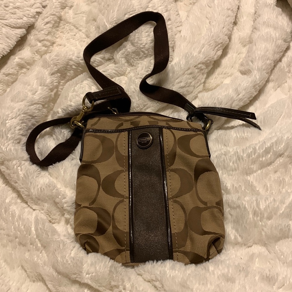 Brown and tan coach crossbody purse no holes and is in great condition